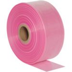 An unrolled MH-USA 16 x 1075 - 4 Mil Anti-Static Poly Tubing roll in pink plastic sheeting, on a brown cardboard core.