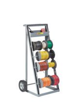 The gray Little Giant Wire Reel Caddy, labeled Klein Tools, has two large wheels and holds various colorful cable spools, including black, white, red, yellow, green, brown, and orange. It features a small top tray for tools.