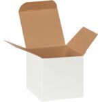 The MH-USA 3 x 3 x 3 White Reverse Tuck Folding Cartons (250/Case) are shown open, with flaps spread to reveal a brown interior. Displayed at an angle, they emphasize the cubic design and simplicity of these versatile packaging cartons.