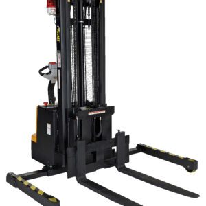 The image shows a Vestil Adjustable Extendable Fork Stacker in black, featuring long forks and a control handle. It has a yellow base with striped safety markings, designed for efficient lifting and transport of heavy loads.