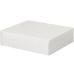 Viewed from a slightly elevated angle, a plain, closed MH-USA 11 1/8 x 9 1/2 x 3 Stationery Folding Carton, featuring clean edges and an unmarked surface, rests against a simple white background.