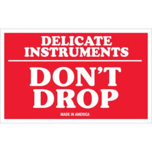 The MH-USA 3 x 5 Delicate Instruments - Dont Drop labels, in bold white text on a red background with MADE IN AMERICA noted below, come in rolls of 500 to ensure careful handling of your fragile items.