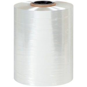 A large transparent roll of MH-USA 12 x 60 Gauge x 4375 Polyolefin Shrink Film (1 Roll/Case) with a brown cardboard core is standing upright against a plain white background, appearing slightly reflective.
