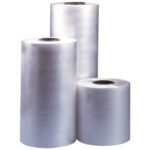 Three upright rolls of transparent film are shown. On the left is the MH-USA 14x100 Gauge x 2625 Polyolefin Shrink Film towering over shorter rolls on the right, all with a glossy, smooth surface.