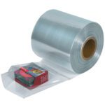The MH-USA 14 x 100 Gauge x 1500 Shrink Tubing, with a sturdy cardboard core, lies on its side. It showcases colorful boxes stacked beneath the clear plastic wrapping, ideal for secure packaging needs.