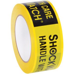 A roll of ShockWatch® 2 x 110 yds. alert tape featuring HANDLE WITH CARE and SHOCKWATCH in bold black text signals careful handling necessity, standing upright on a white background, poised for safe transit.