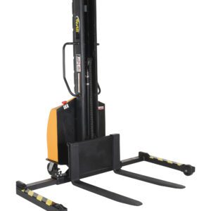 The Vestil Stacker Narrow Mast Adj Forks 63 In 1.5K, in orange and black, features adjustable forks extending to 63 inches, a vertical mast, and mobility wheels. It safely handles loads up to 1.5K pounds with clearly marked tines laid on the floor.
