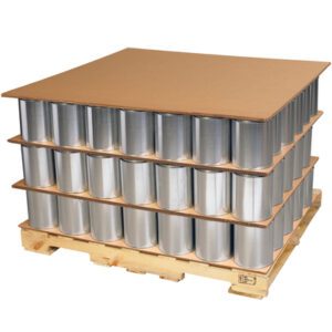 Triple Wall Corrugated Sheets by MH-USA separate stacked metal cans on a wooden pallet, which is organized into three layers of tightly packed cylinders for stability and protection.
