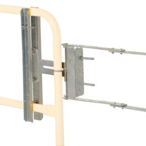 A Vestil Galvanized Self-Closing Gate (16–26 inches) is ideal with a metal bracket featuring a rectangular frame on a cream vertical support, designed for secure mounting with adjustable sliding parts and visible screws.