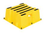 The Vestil Step Poly Nestable 1 Step Yl is a vivid yellow plastic stool with five black rubber strips for grip, a side hole for easy transport, and stable black rubber feet at each corner.