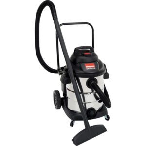 The Shop-Vac - 10 Gallon, Stainless Steel Vacuum features a sleek black top, large hose, and nozzle. Designed for convenience, it includes wheels for easy mobility and a handle for effortless transport. Packaged as 1 PER CASE.