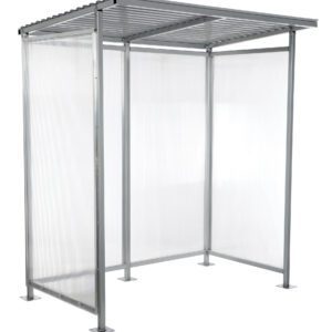 The Vestil Smoking Shelter Bus Stop is a compact metal and polycarbonate structure with a slanted roof and three sides. It features a minimalist design, light gray frame, clear panels, and stands on four square bases.