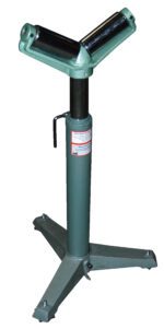 The Vestil V Roller Stand 26 to 36 In Range is a green metal stand with a V-shaped top and rollers. Supported by a three-legged base, it stabilizes cylindrical objects and features an easy-to-use side handle for adjustments.