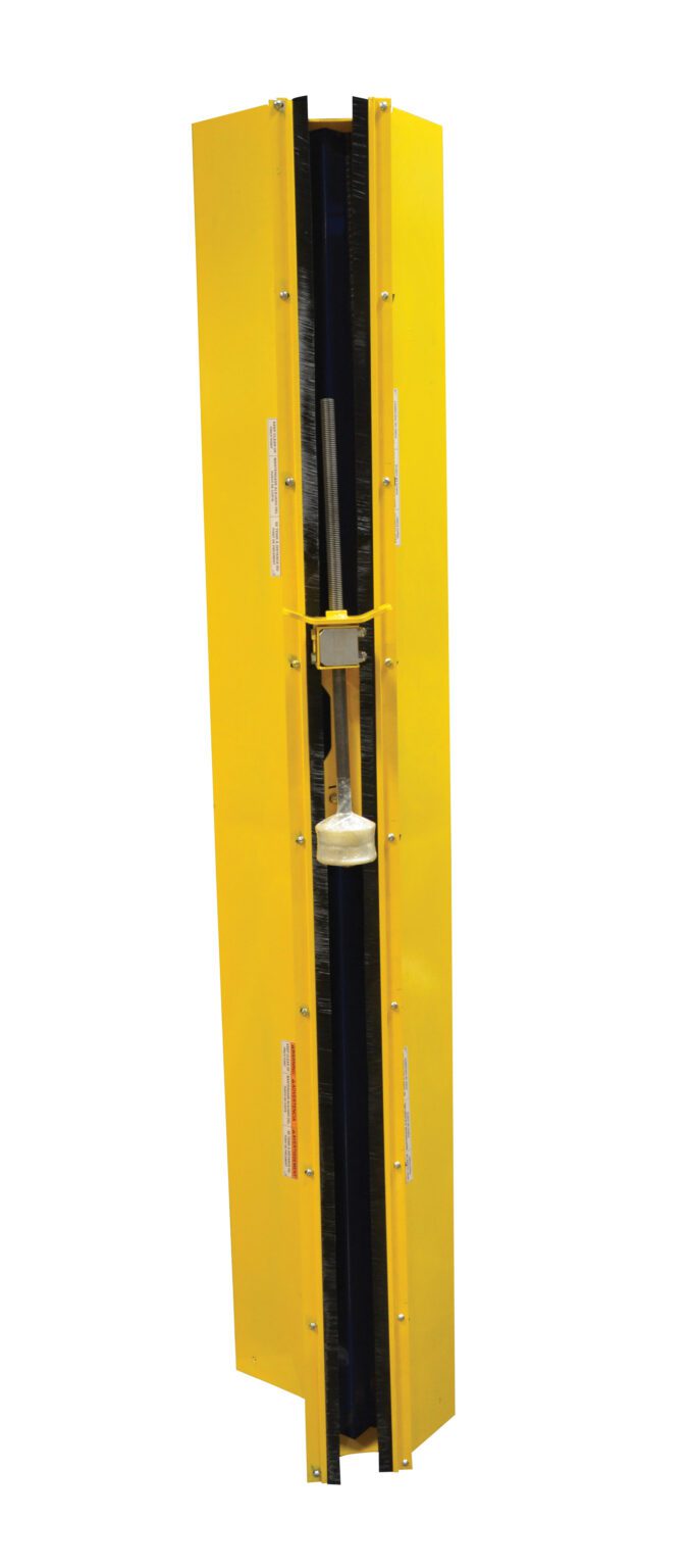 A tall yellow industrial machine part with a central cavity holding a rod and brush-like components, featuring the Vestil Stretch Wrap Power Mast Chain Guard technology. It includes labels, black vertical sections on the sides, set against a plain white background.