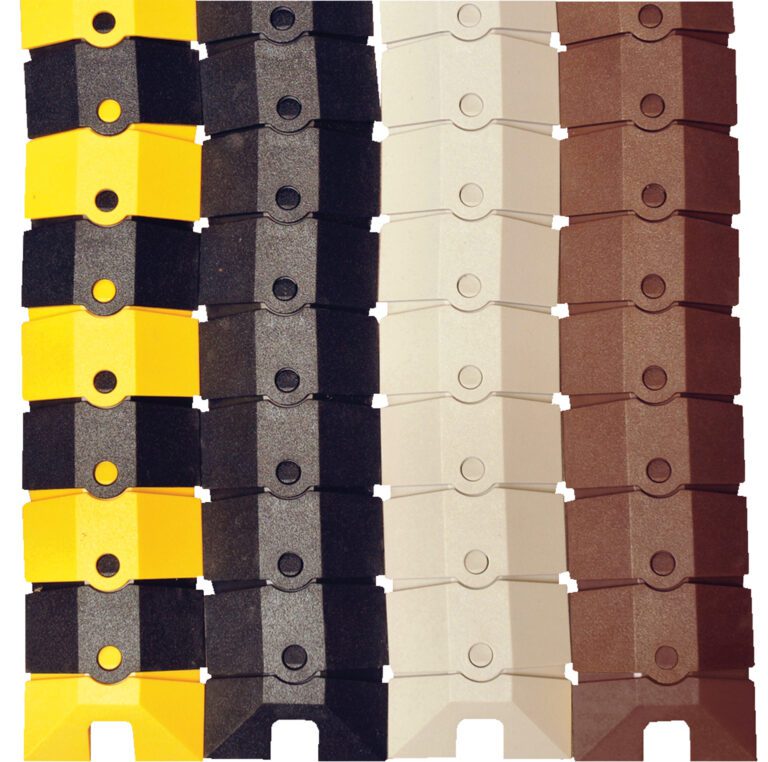 Vertically displayed interlocking plastic chains in yellow, black, white, and brown resemble the Vestil Sidewinder Cable Extension- 12X3 Ylw/Blk, with each chain featuring a central circular hole that forms a striking pattern of contrasting colors.