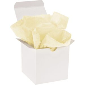 An open white gift box, partially unsealed, is filled with crumpled MH-USA 20 x 30 Yellow Gift Grade Tissue Paper (480 Sheets), suggesting a present is ready to be wrapped or has just been unwrapped.
