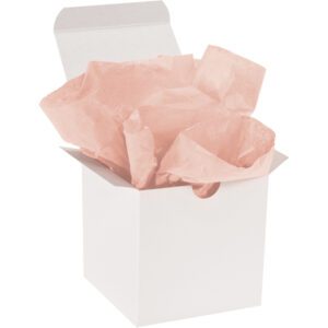 An open white gift box is filled with MH-USA 20 x 30 Peach Gift Grade Tissue Paper, adding elegance and color. The plain design makes it perfect for any occasion.