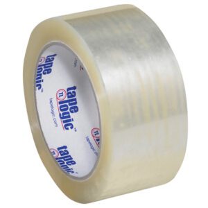 A roll of 2 x 55 yds. Clear Tape Logic® Lbs1000 Economy Tape, with the label visible inside featuring Tape Logic in blue and red, is wound tightly at an angle against a plain background. The roll is part of a case containing 36 rolls.