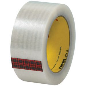 The 2 x 110 yds. Clear Scotch® Box Sealing Tape 371 features a clear design with a red and black plaid edge and a marked inner yellow core, ensuring secure package sealing. It comes in cases of 36, ideal for all your packing needs.
