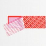 A 2 x 5 3/4 Red Tape Logic® Security Strip from a roll is peeled off, revealing VOID in white on a transparent layer. Each strip displays VOIDED, ensuring tamper evidence. Available in 24 rolls per case.