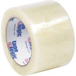 A roll of 3 x 110 yds. Tape Logic® Lbs7651 Cold Temperature Tape in clear, with a branded core, sits upright. Its glossy finish indicates a smooth adhesive surface, perfect for tough conditions. Sold in cases of 24 rolls.