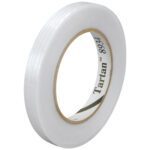 A roll of 3/8 x 60 yds. Tartan™ Filament Tape 8934 sits at a slight angle, featuring clear, shiny tape wound around a brown cardboard core labeled Tartan 8934, and is packaged conveniently in a case of 12 for all your needs.