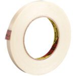 A roll of 1/2 x 60 yds. Scotch® Filament Tape 898 with a tan core and partially unrolled sticky side displays the brand name in black, highlighting precision and quality.