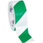 A partially unrolled 2 x 36 yds. Green/White Tape Logic® Striped Vinyl Safety Tape highlights its diagonal stripes. The tapes inner ring bears the brand logo, making it ideal for safety marking. Available in a case of 24 rolls.