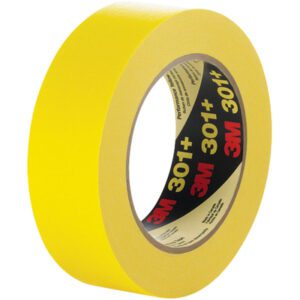 A 12-pack of 3M Performance Yellow Masking Tape 301+ (1/2 x 60 yds.) stands upright, displaying its branded label. The tightly wound tape highlights its vibrant color and commercial-grade quality.