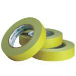 Three rolls of 1 x 60 yds. 3M™ 2060 masking tape are stacked on a white background, displaying the Scotch brand on the core.