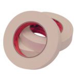 Two rolls of 3M™ 213 Masking Tape, each 1 x 60 yds., lie overlapping, revealing a red inner layer likely indicating the brand. Designed for office or painter use, this reliable tape offers quality performance for projects.