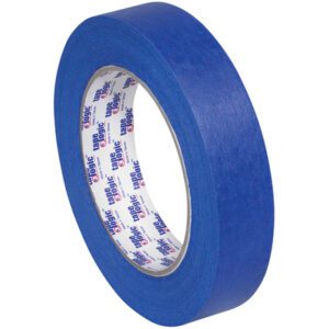Set on a white background, the 1 x 60 yds. (12 Pack) Tape Logic® - Lbs3000 Blue Painters Tape features smooth, thick material and white inner labels with red and blue text to highlight its quality.