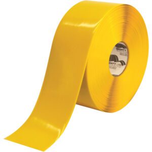 The 4 x 100 Yellow Mighty Line™ Deluxe Safety Tape (1 Roll/Case) features a wide, flat surface with vibrant color, a smooth texture, and printed text on the inner core.