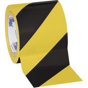 The 4 x 36 yds. Black/Yellow Tape Logic® Striped Vinyl Safety Tape (3 Pack) showcases bold black and yellow diagonal stripes similar to caution tape, ensuring clear visibility for safety markings.