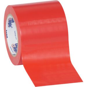 A partially unrolled roll of 4 x 36 yds. Red Tape Logic® Solid Vinyl Safety Tape reveals its smooth, glossy surface against a white background. This essential safety tape, with printed text on its inner core, is available in cases containing 12 rolls for versatile use.