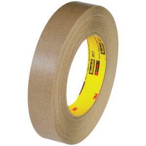 The 3M™ 2517 Flatback Tape, 3/4 x 60 yds., comes in a pack of 12 with a brown adhesive and smooth texture. It features a yellow Scotch label for easy identification.
