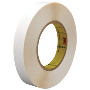 The 1/2 x 36 yds. 3M™ 9579 Double Sided Film Tape features a yellow inner core with printed text and logos. It is positioned upright, showcasing its width and coiled layers. Available in cases of 72 rolls, its perfect for versatile adhesive needs.