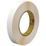The 1/2 x 36 yds. (2 Pack) 3M™ 9579 Double Sided Film Tape stands upright and features a yellow core with red markings, offering a clean look for your adhesive needs.