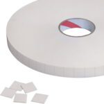 A large roll of adhesive tape shows its core, while multiple 1 x 1 Tape Logic® 1/16 Double Sided Foam Squares (324 Pcs/Roll) are separate below, showcasing their versatility and detachable nature.