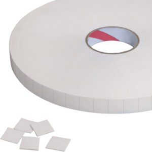 A large roll of textured double-sided adhesive foam tape with a center hole is accompanied by several Tape Logic® 1 x 1 removable double-sided foam squares (648 pcs/roll), neatly placed nearby.