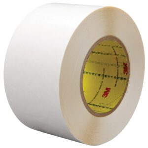 A large roll of 2 x 36 yds. 3M™ 9579 durable white double-sided film tape with a yellow inner core, red logo, and black text; thick and reflective, sold in sets of 24 rolls per case.