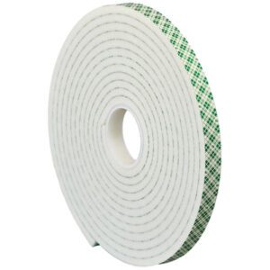 A 1 x 5 yds. roll of 3M Double Sided Foam Tape 4004, displaying a green plaid pattern, stands upright against a white background, tightly wound to showcase spiral layers.