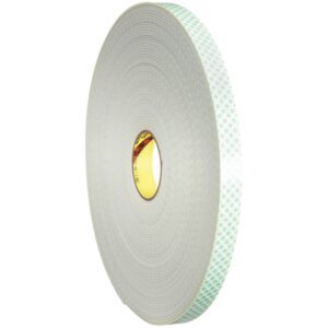 A 2 x 36 yds. roll of 3M™ 4008 Double Sided Foam Tape is displayed vertically against a white backdrop, highlighting its gray surface and the green grid pattern on its protective layer.