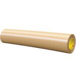 An 18 x 60 yds. roll of brown kraft paper, similar in size to the 3M™ 465 Adhesive Transfer Tape Hand Rolls - 1 PER CASE, lies horizontally on a white background. The surface is smooth, with the inner core showing subtle hints of yellow and orange details.