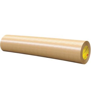 An 18 x 60 yds. roll of brown kraft paper, similar in size to the 3M™ 465 Adhesive Transfer Tape Hand Rolls - 1 PER CASE, lies horizontally on a white background. The surface is smooth, with the inner core showing subtle hints of yellow and orange details.