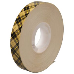 The 3M™ 908 Adhesive Transfer Tape, measuring 1/2 x 36 yds., features a plaid design in yellow, gold, and black on a white plastic spool. Its available in a convenient 6-pack with a plain white background.