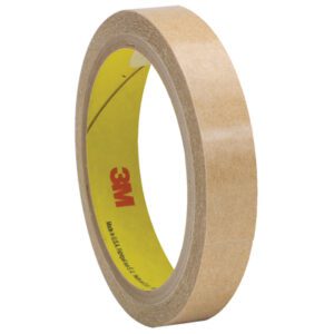 A roll from the 3M™ 950 Adhesive Transfer Tape (1/2 x 60 yds., 6 Pack) stands upright, showcasing its tan surface and yellow core with red 3M branding. It is partially unraveled, revealing its adhesive for precise tasks.