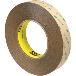 The 1 x 60 yds. (3 Pack) 3M™ 9472LE Adhesive Transfer Tape features a yellow core and brown layer with 3M 300LSE text, ideal for reliable adhesion and available in a case of three rolls.