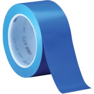 A roll from the 2 x 36 yds. Blue (3 Pack) 3M Vinyl Tape 471 is partially unwound, showing brand details in gray on the inside, while its glossy surface reflects light beautifully.