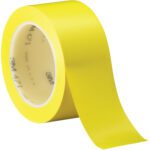 A roll of 2 x 36 yds. yellow 3M Vinyl Tape 471 is partially unrolled, featuring the brand and model on its inner ring, and packaged as 24 per case.